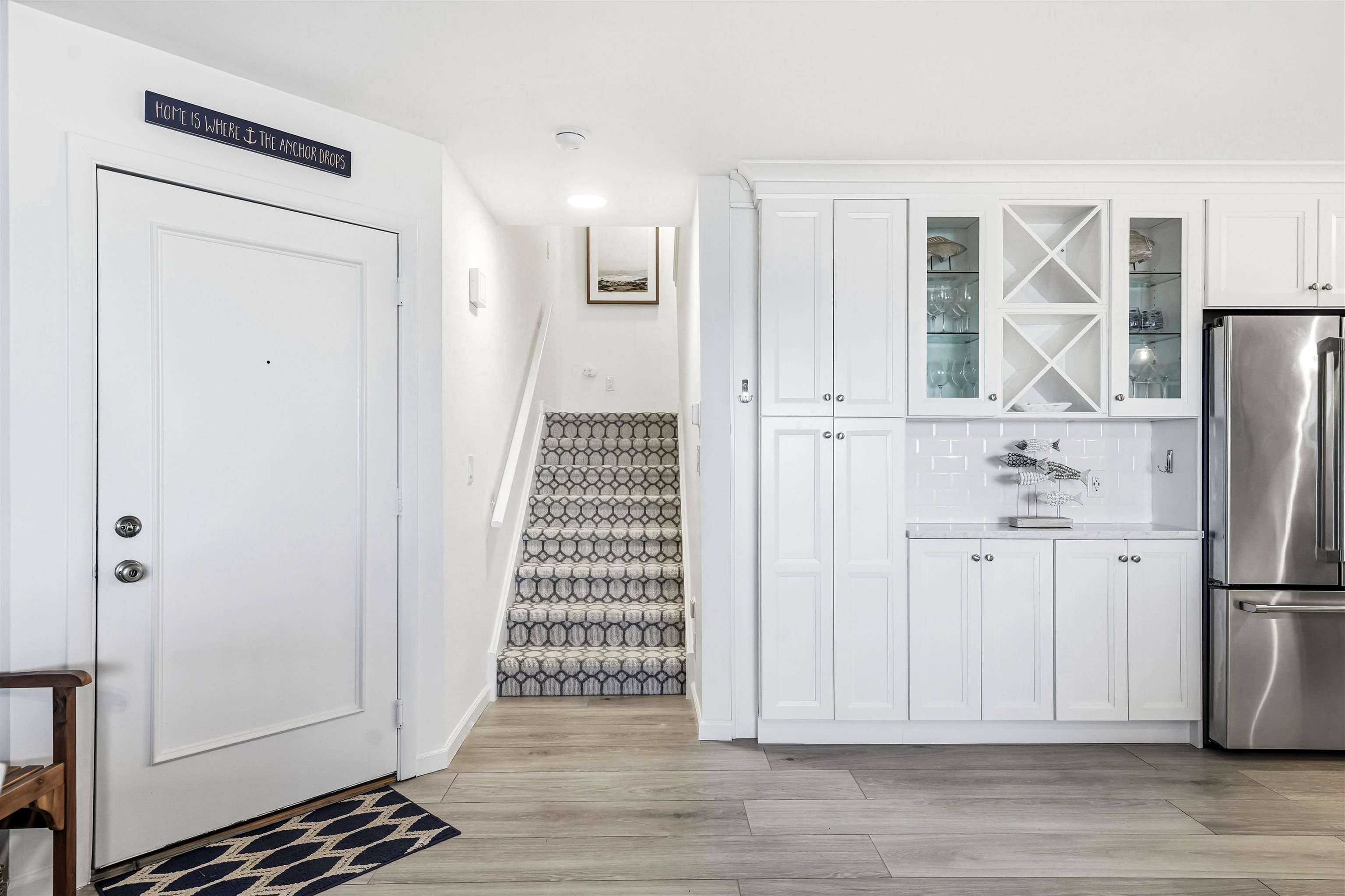 902 Ocean, Unit 906 Cape May, NJ 08204 - Photo 21 of 47 a view of a kitchen with wooden floor and white doors