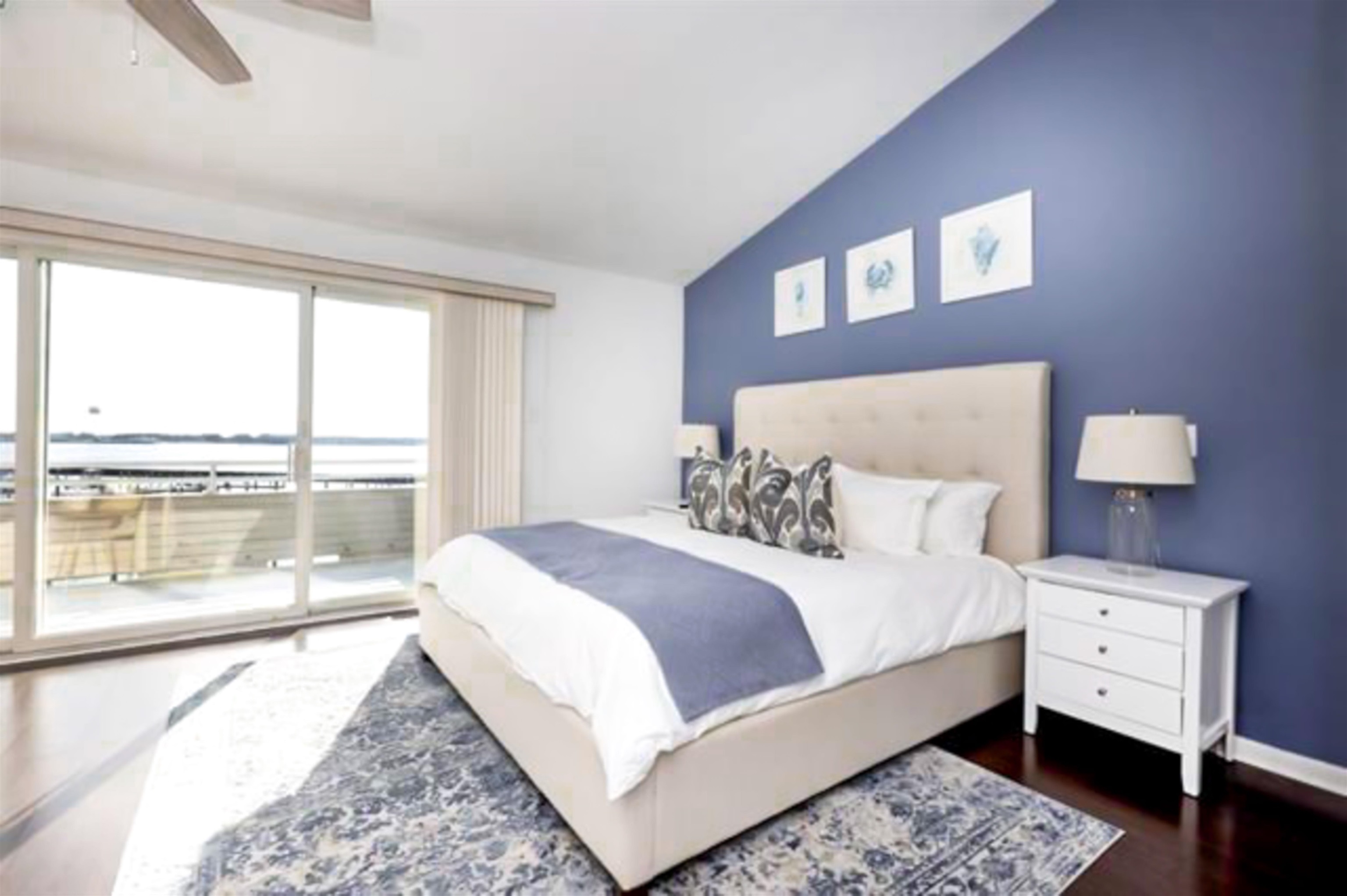 902 Ocean, Unit 906 Cape May, NJ 08204 - Photo 28 of 47 a bedroom with a large bed and a large window