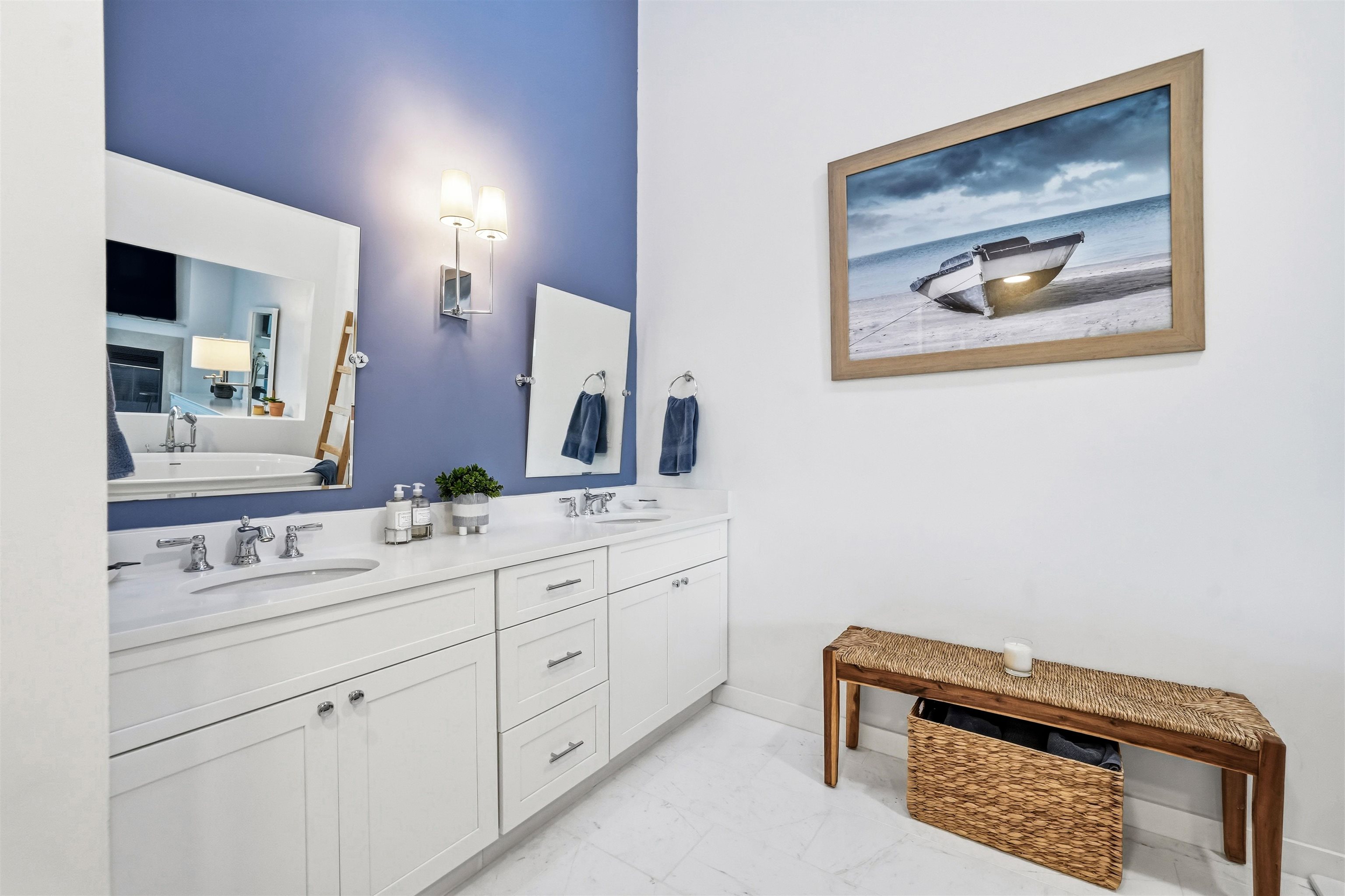 902 Ocean, Unit 906 Cape May, NJ 08204 - Photo 31 of 47 a bathroom with a double vanity sink and a mirror
