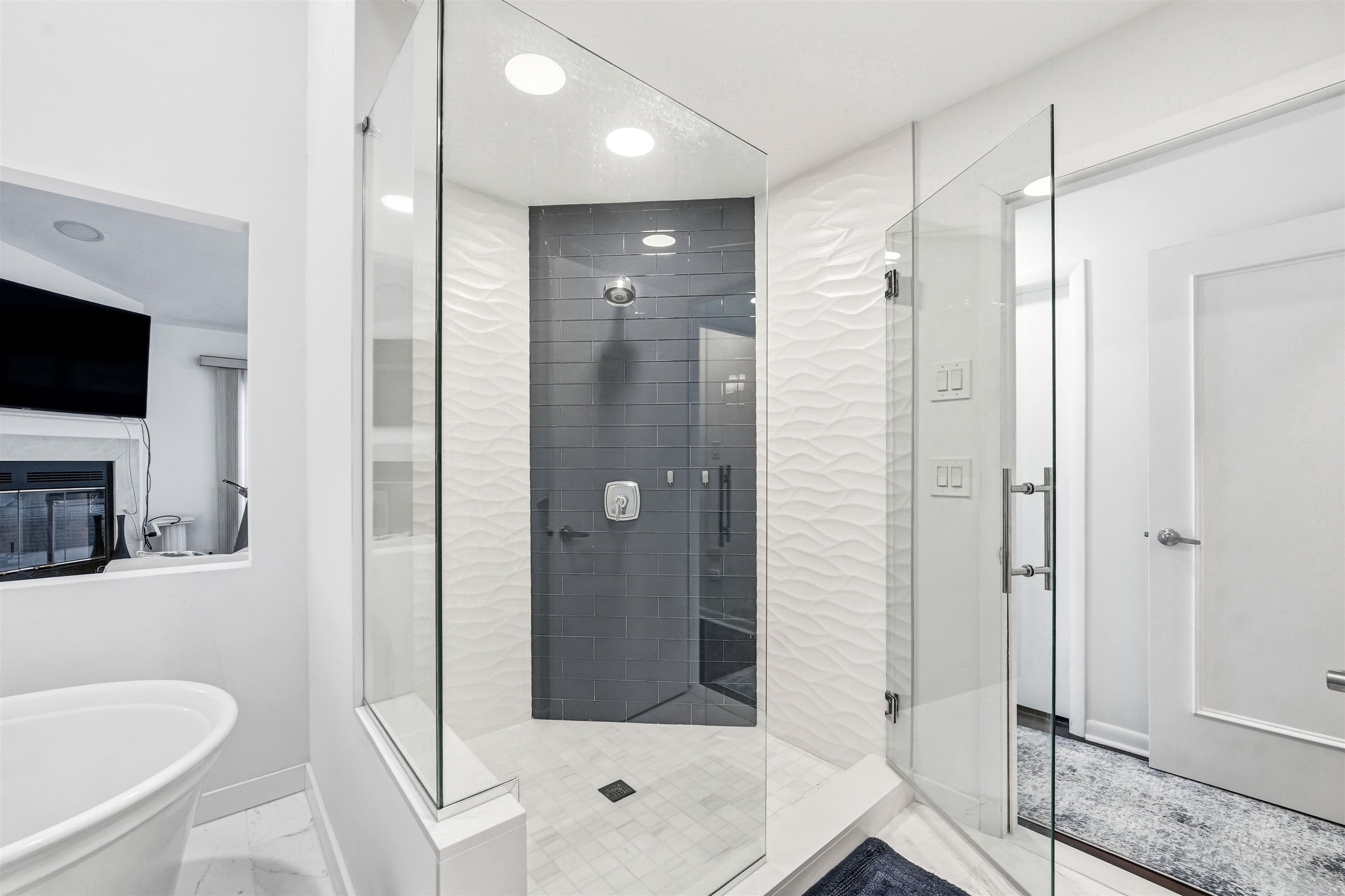 902 Ocean, Unit 906 Cape May, NJ 08204 - Photo 34 of 47 a bathroom with a shower a sink and a mirror