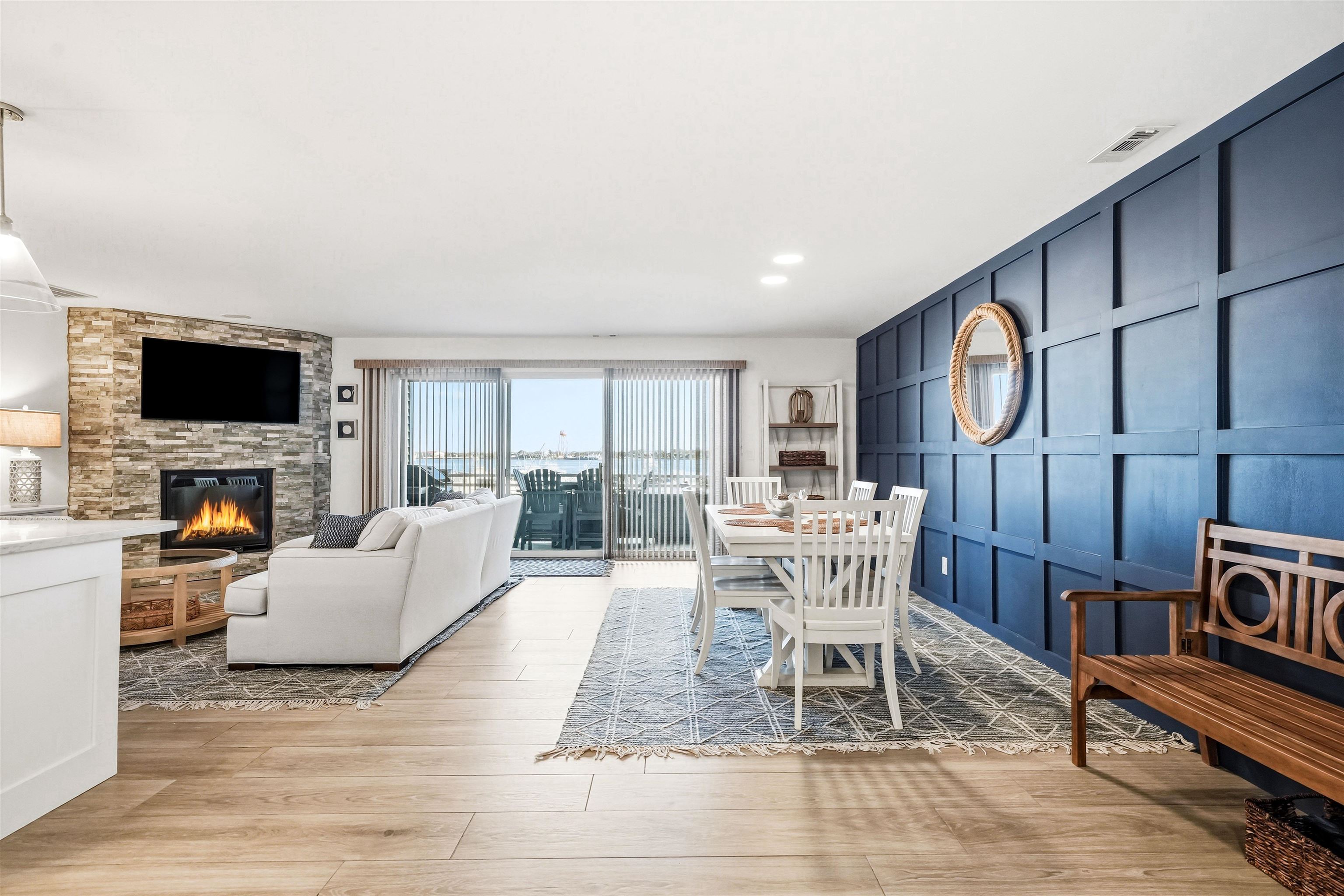 902 Ocean, Unit 906 Cape May, NJ 08204 - Photo 5 of 47 a living room with furniture a fireplace and a flat screen tv