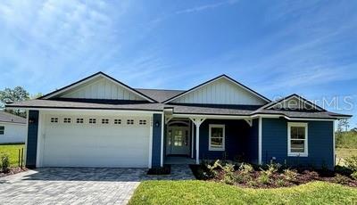 5949 South E County Road 21B Keystone Heights, FL 32656 - Photo 1 of 30 a front view of a house with garden
