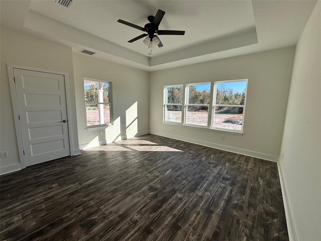 5949 South E County Road 21B Keystone Heights, FL 32656 - Photo 12 of 30 wooden floor in an empty room with a window