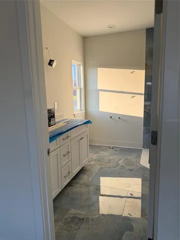 a bathroom with a sink a vanity and a mirror