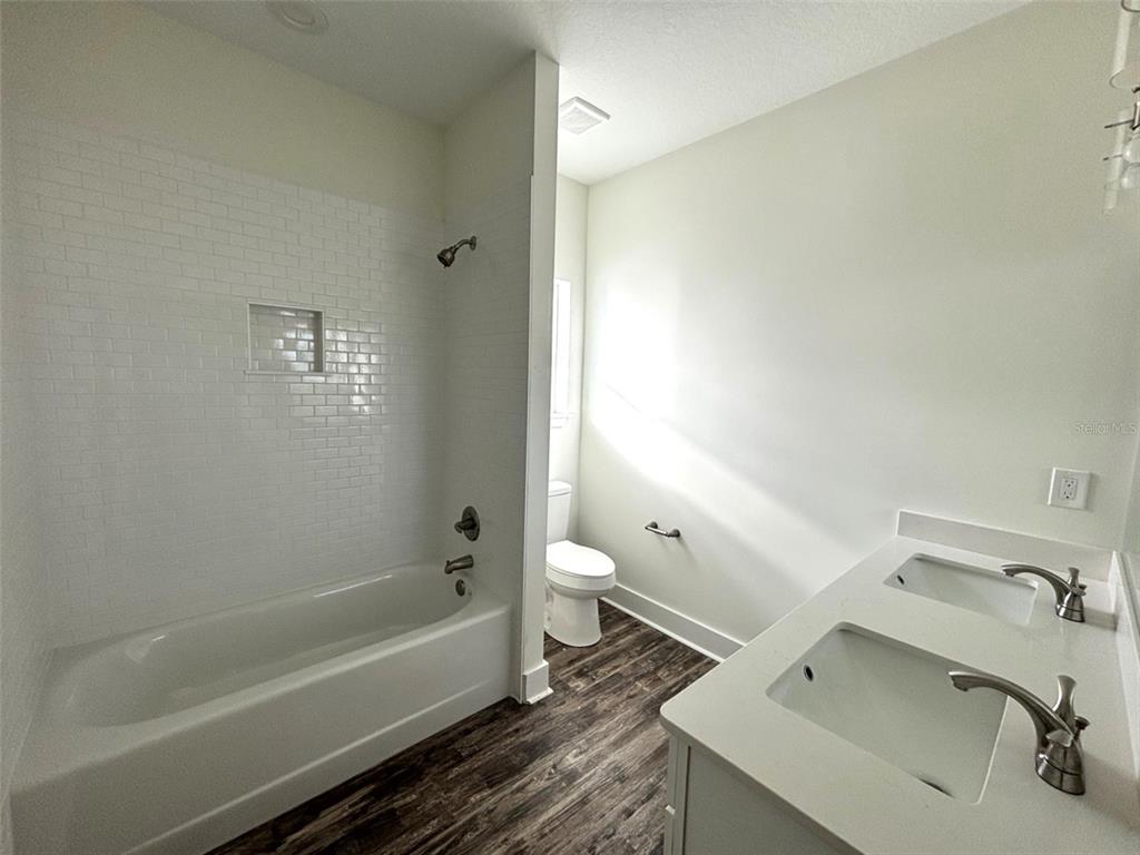 5949 South E County Road 21B Keystone Heights, FL 32656 - Photo 18 of 30 a bathroom with a sink and a bathtub