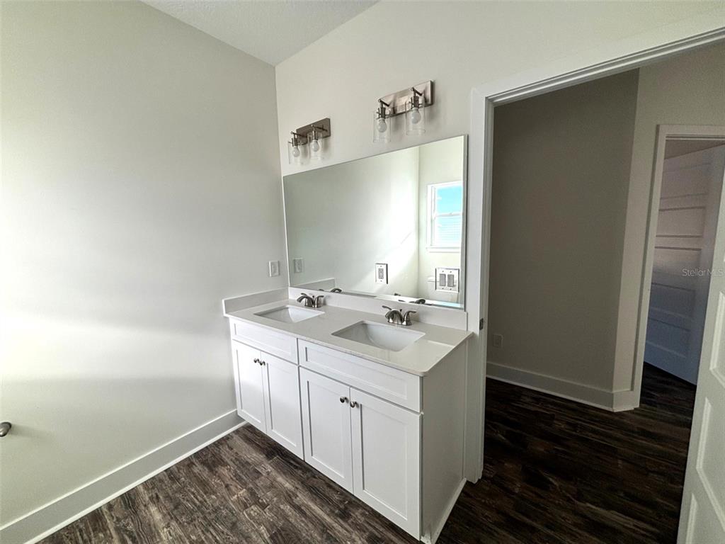 5949 South E County Road 21B Keystone Heights, FL 32656 - Photo 19 of 30 a bathroom with a sink and a mirror