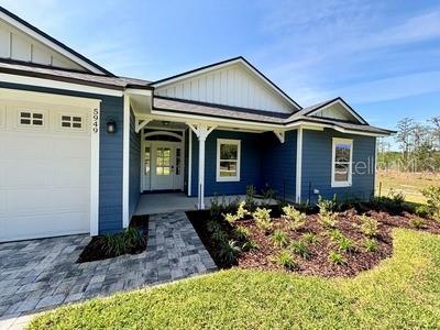 5949 South E County Road 21B Keystone Heights, FL 32656 - Photo 2 of 30 a front view of a house with garden