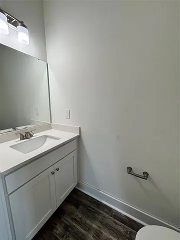 a bathroom with a sink and mirror
