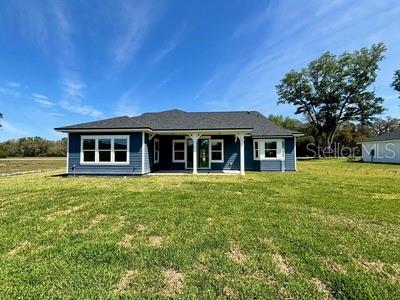 5949 South E County Road 21B Keystone Heights, FL 32656 - Photo 28 of 30 a front view of a house with a garden