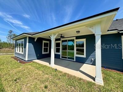 5949 South E County Road 21B Keystone Heights, FL 32656 - Photo 30 of 30 a view of a house with a backyard and porch