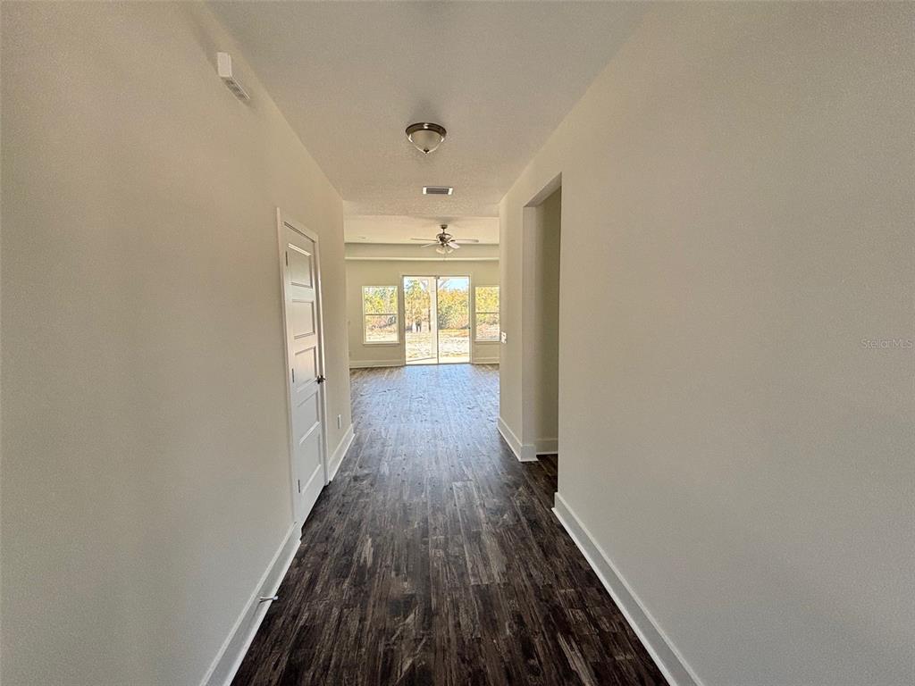 5949 South E County Road 21B Keystone Heights, FL 32656 - Photo 5 of 30 a view of hallway with wooden floor