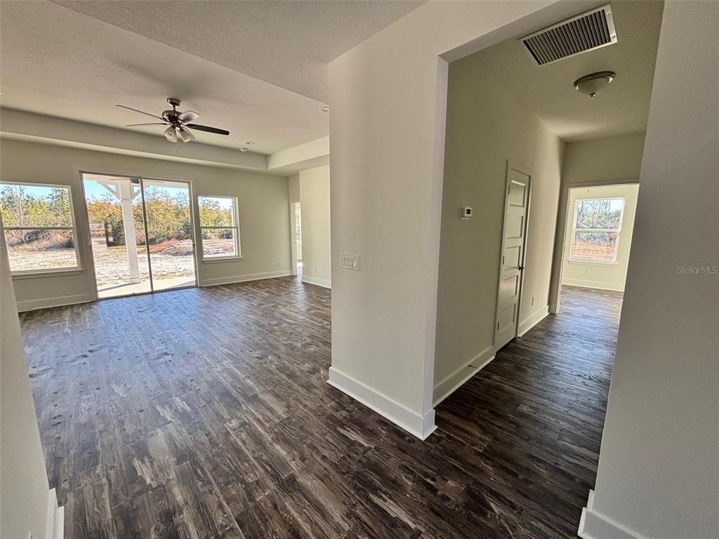5949 South E County Road 21B Keystone Heights, FL 32656 - Photo 6 of 30 wooden floor in an empty room with a window