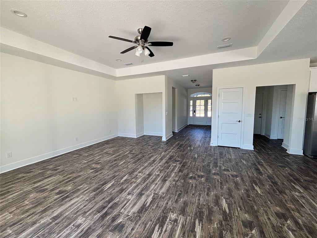 5949 South E County Road 21B Keystone Heights, FL 32656 - Photo 7 of 30 a view of empty room with wooden floor and ceiling fan