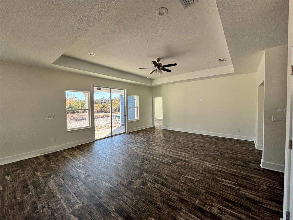 5949 South E County Road 21B Keystone Heights, FL 32656 - Photo 8 of 30 wooden floor in an empty room with a window