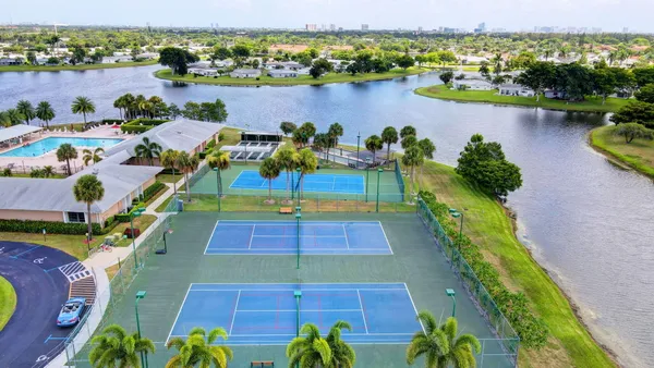 an aerial view of a houses with outdoor space