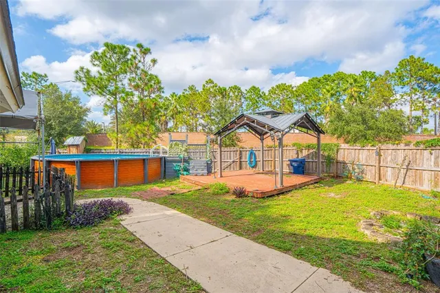 a view of a backyard with a garden