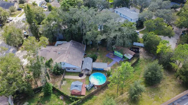 an aerial view of a house with a swimming pool