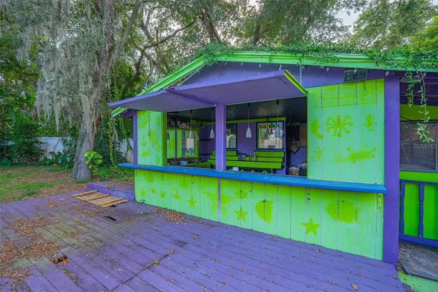 a room with musical instruments pool table and chairs