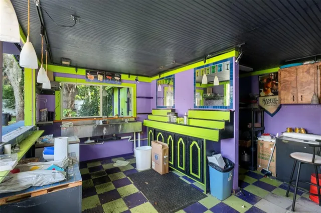 a open kitchen with stainless steel appliances granite countertop a sink and cabinets