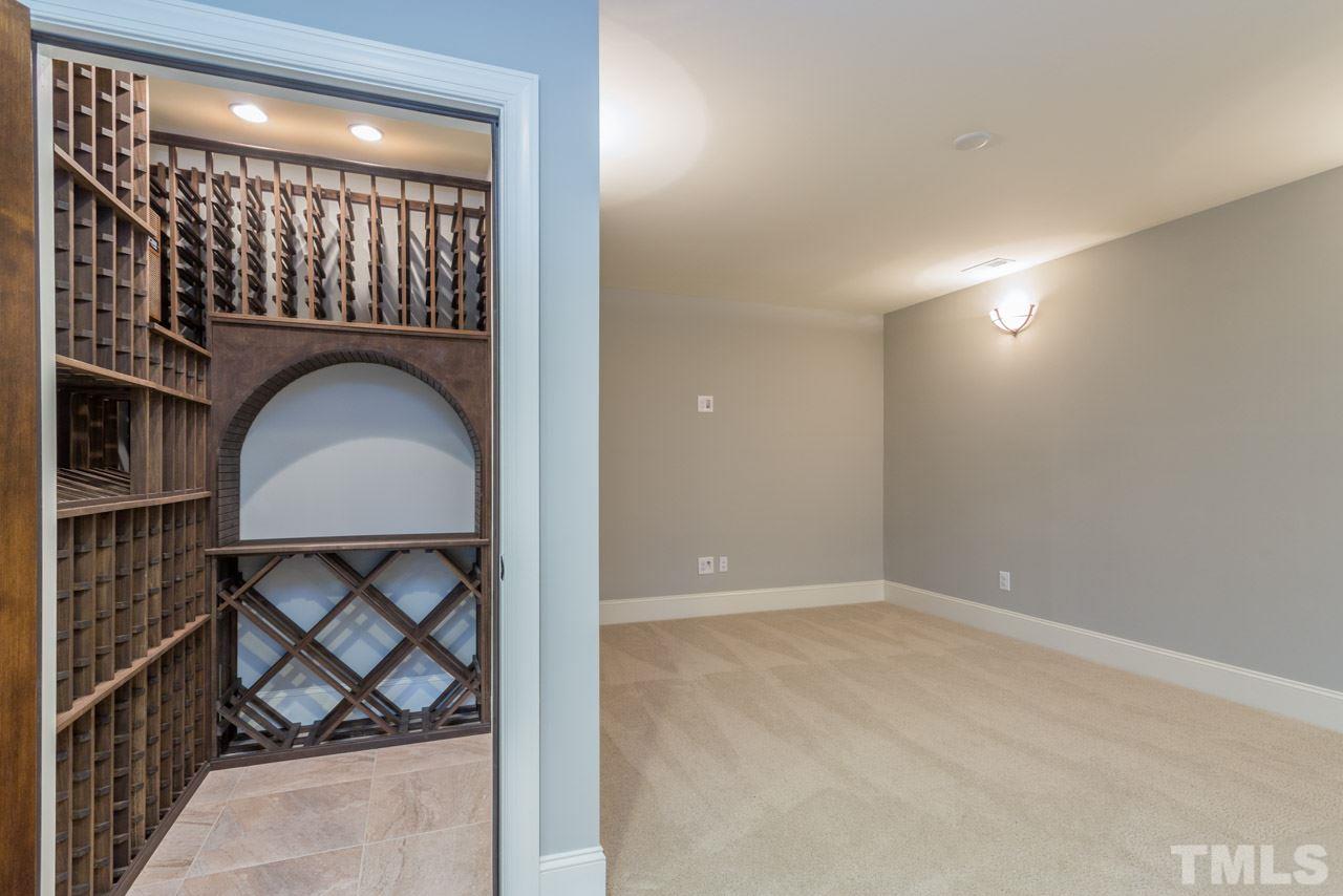 5011 Pomfret Point Raleigh, NC 27612 - Photo 22 of 25 The charming wine room is located in the finished basement offers a wine cooler and built-in shelving for a wine collector to fill! It adjoins the rec room and the media room area.