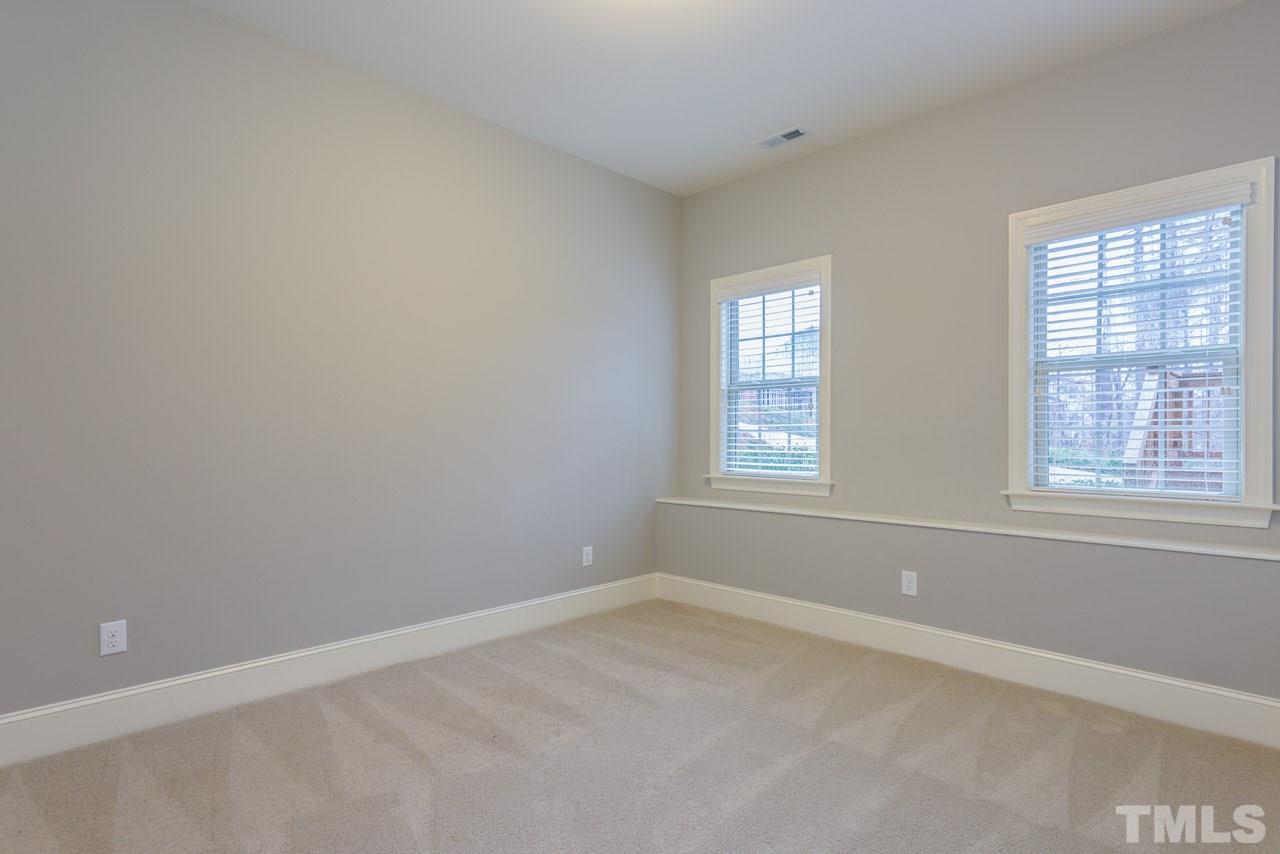 5011 Pomfret Point Raleigh, NC 27612 - Photo 24 of 25 Bedroom #6 is located in one corner of the finished basement and adjoins a full bath.
