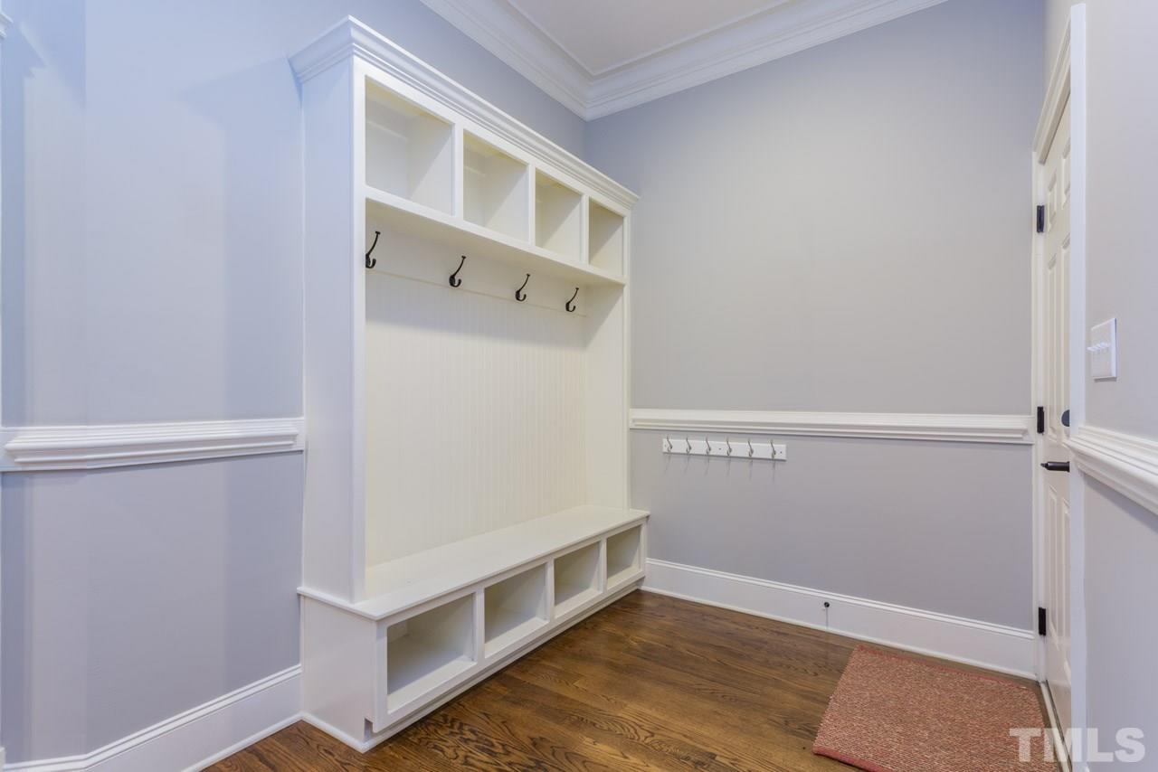 5011 Pomfret Point Raleigh, NC 27612 - Photo 8 of 25 Every busy homeowner LOVES a mudroom off the kitchen! What a perfect place for book bags and sports equipment! This convenient feature is just off the kitchen and features hooks and storage cubbies.