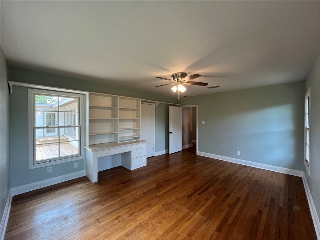 353 Jackson Place Corpus Christi, TX 78411 - Photo 14 of 24 a view of an empty room with a window and wooden floor