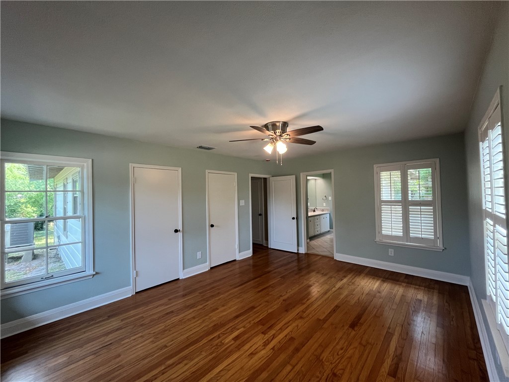353 Jackson Place Corpus Christi, TX 78411 - Photo 19 of 24 a view of an empty room with wooden floor and a window