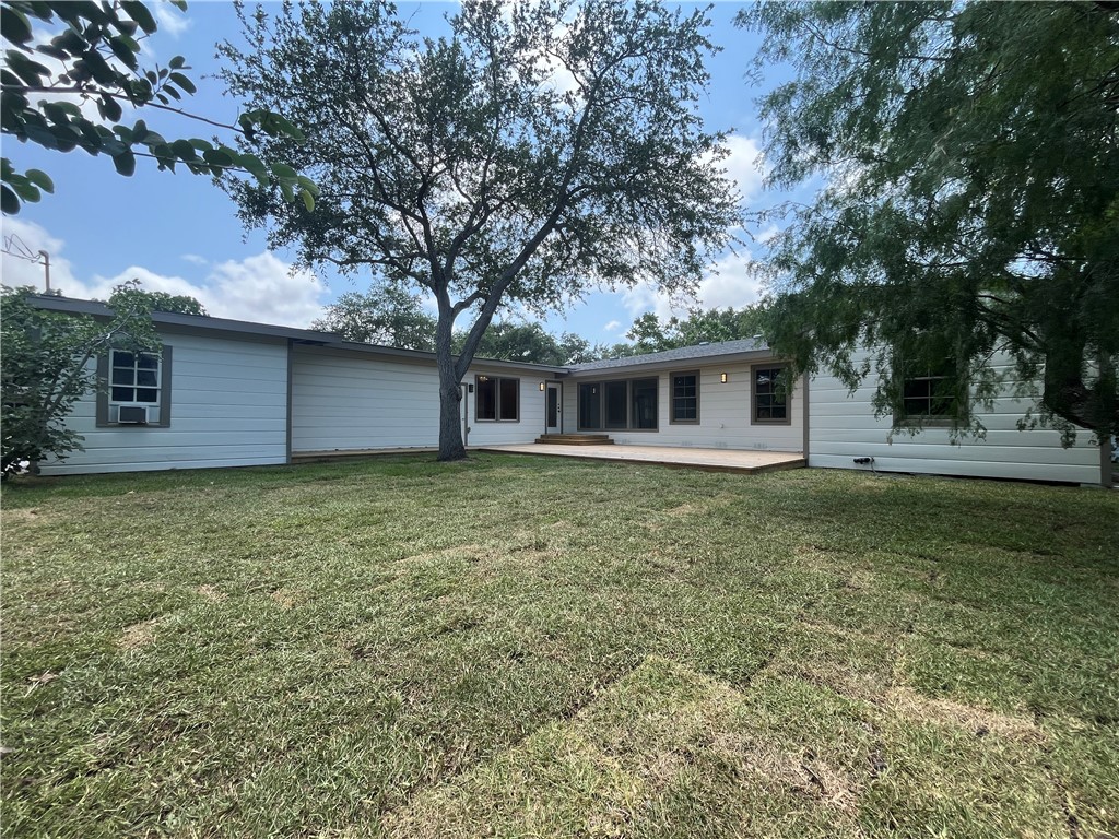 353 Jackson Place Corpus Christi, TX 78411 - Photo 24 of 24 a front view of a house with garden