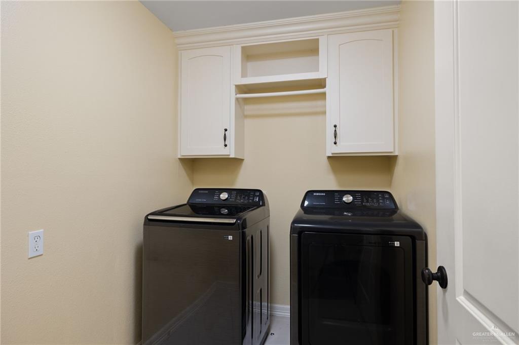 501 Olmo Street Mission, TX 78572 - Photo 12 of 17 a kitchen with a stove and a refrigerator
