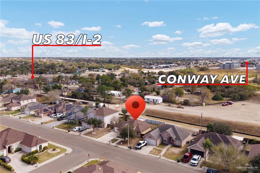 501 Olmo Street Mission, TX 78572 - Photo 16 of 17 a view of a street with cars parked on the road