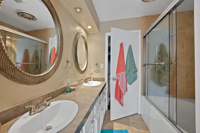 a bedroom with a bed and a fireplace