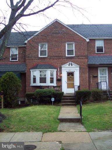 126 Malbrook Road Baltimore, MD 21229 - Photo 1 of 20 a front view of a house with garden