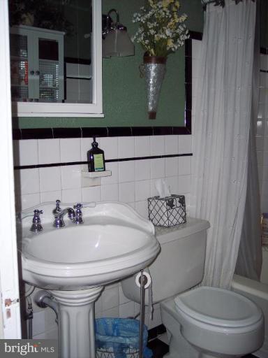126 Malbrook Road Baltimore, MD 21229 - Photo 20 of 20 a bathroom with a toilet and a sink