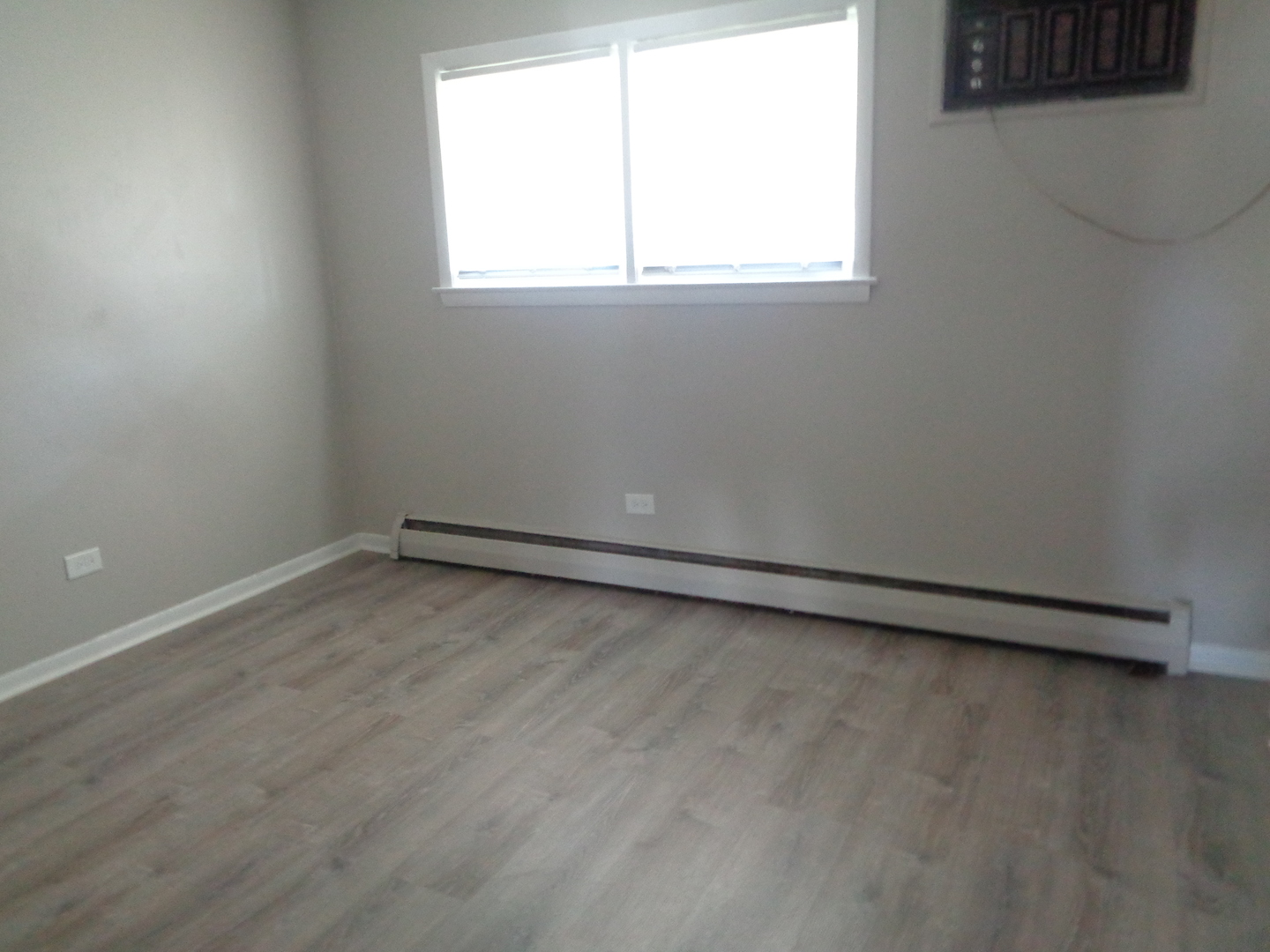 1340 North Main Street, Unit A12 Wheaton, IL 60187 - Photo 7 of 8 an empty room with a window