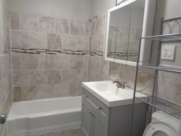 a bathroom with a sink and mirror