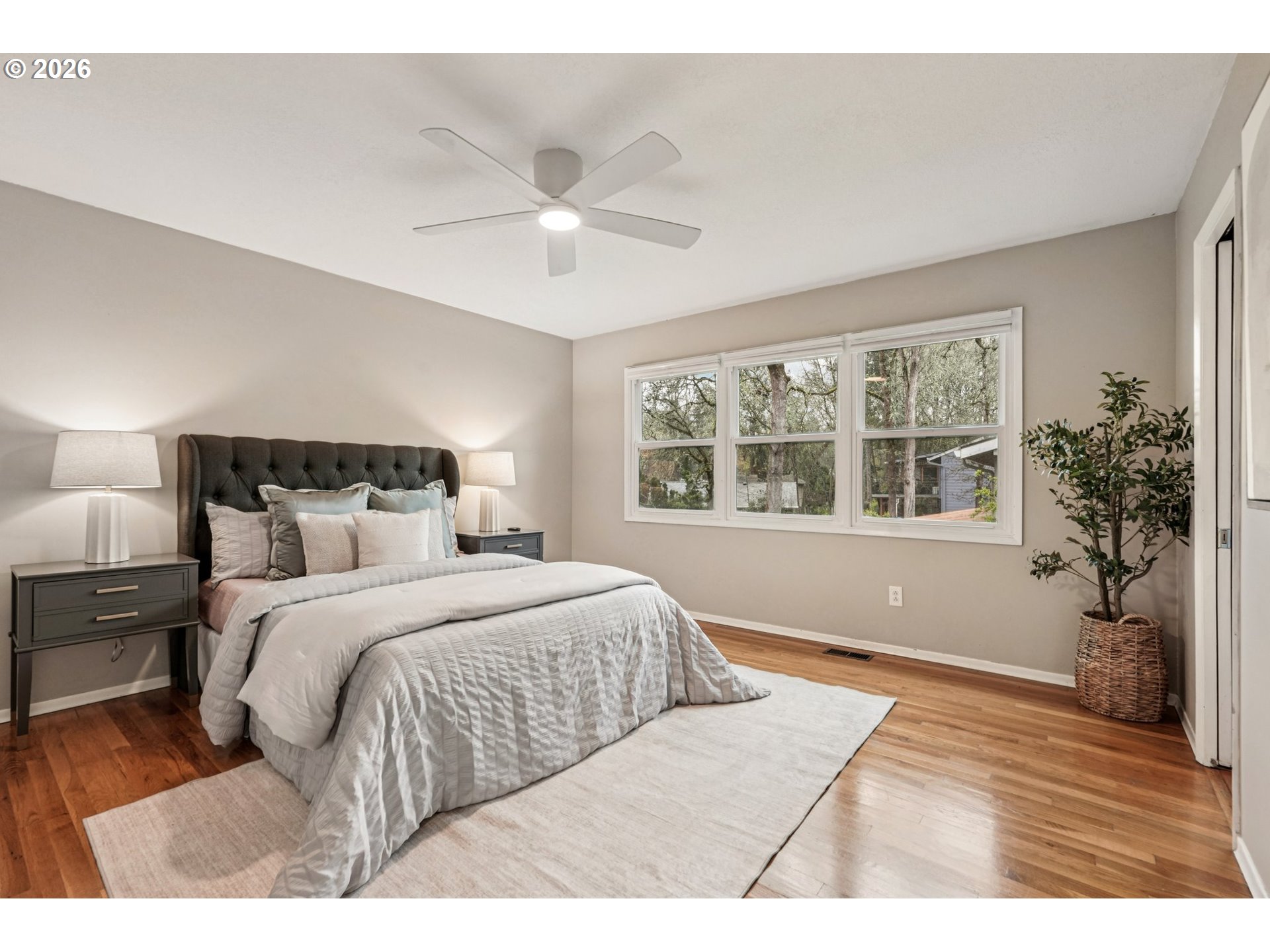 7670 Southwest Danielle Avenue Beaverton, OR 97008 - Photo 16 of 38 a bedroom with a large bed and a window