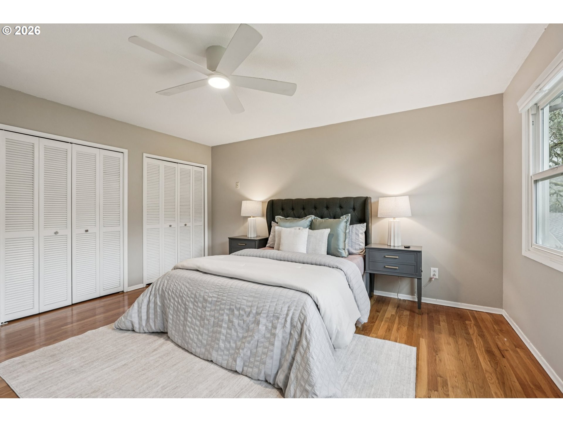 7670 Southwest Danielle Avenue Beaverton, OR 97008 - Photo 17 of 38 a bedroom with a bed and a window