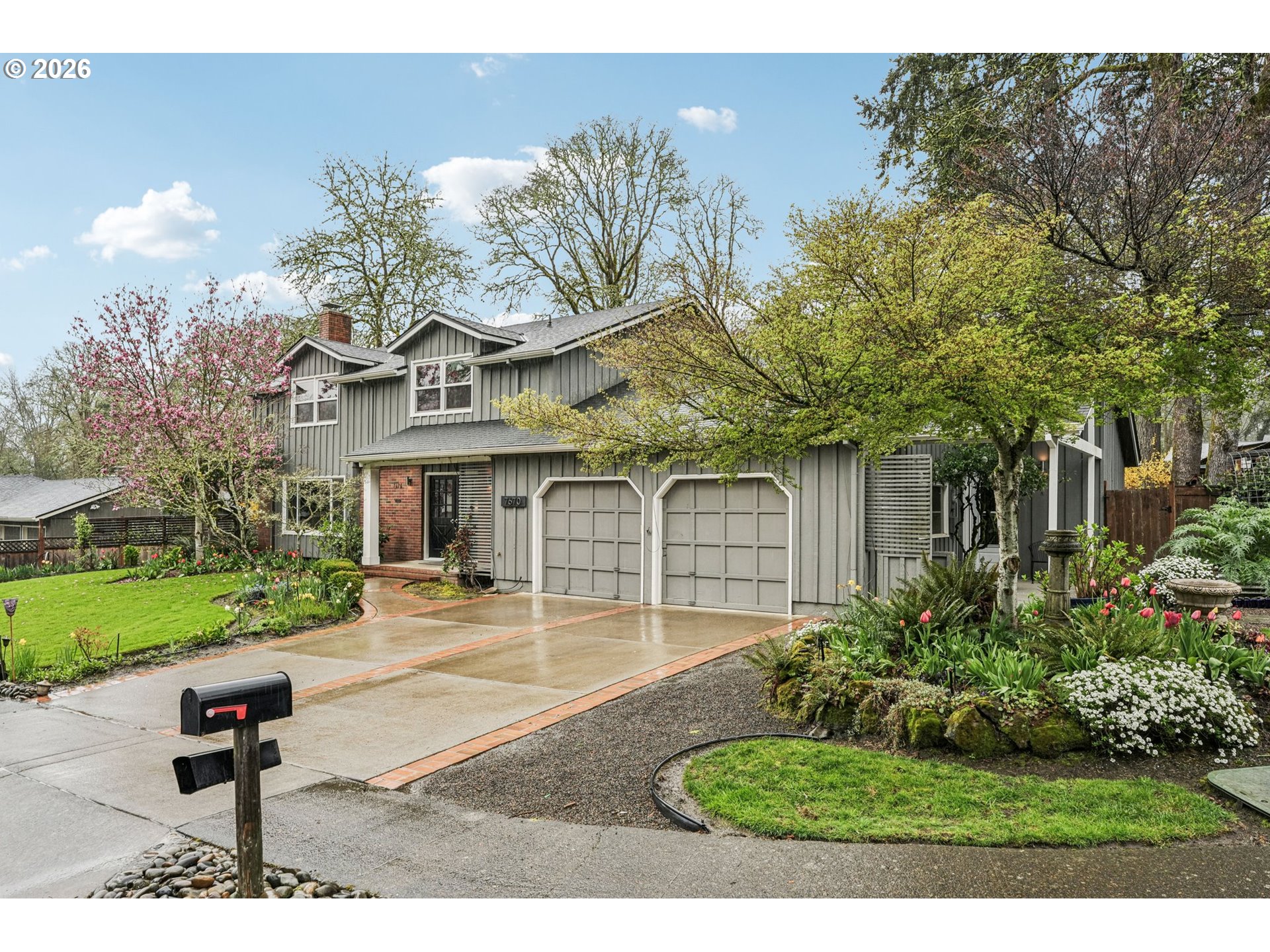 7670 Southwest Danielle Avenue Beaverton, OR 97008 - Photo 2 of 38 a front view of a house with garden