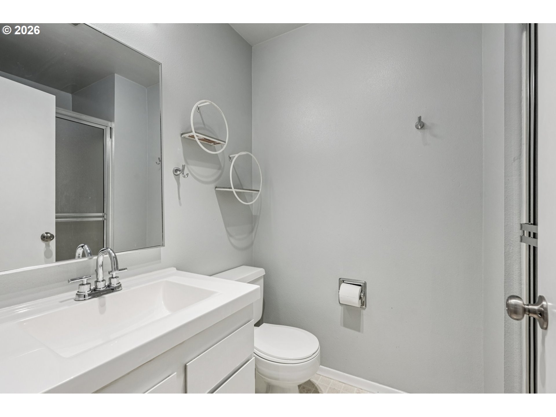 7670 Southwest Danielle Avenue Beaverton, OR 97008 - Photo 22 of 38 a bathroom with a sink toilet and a mirror
