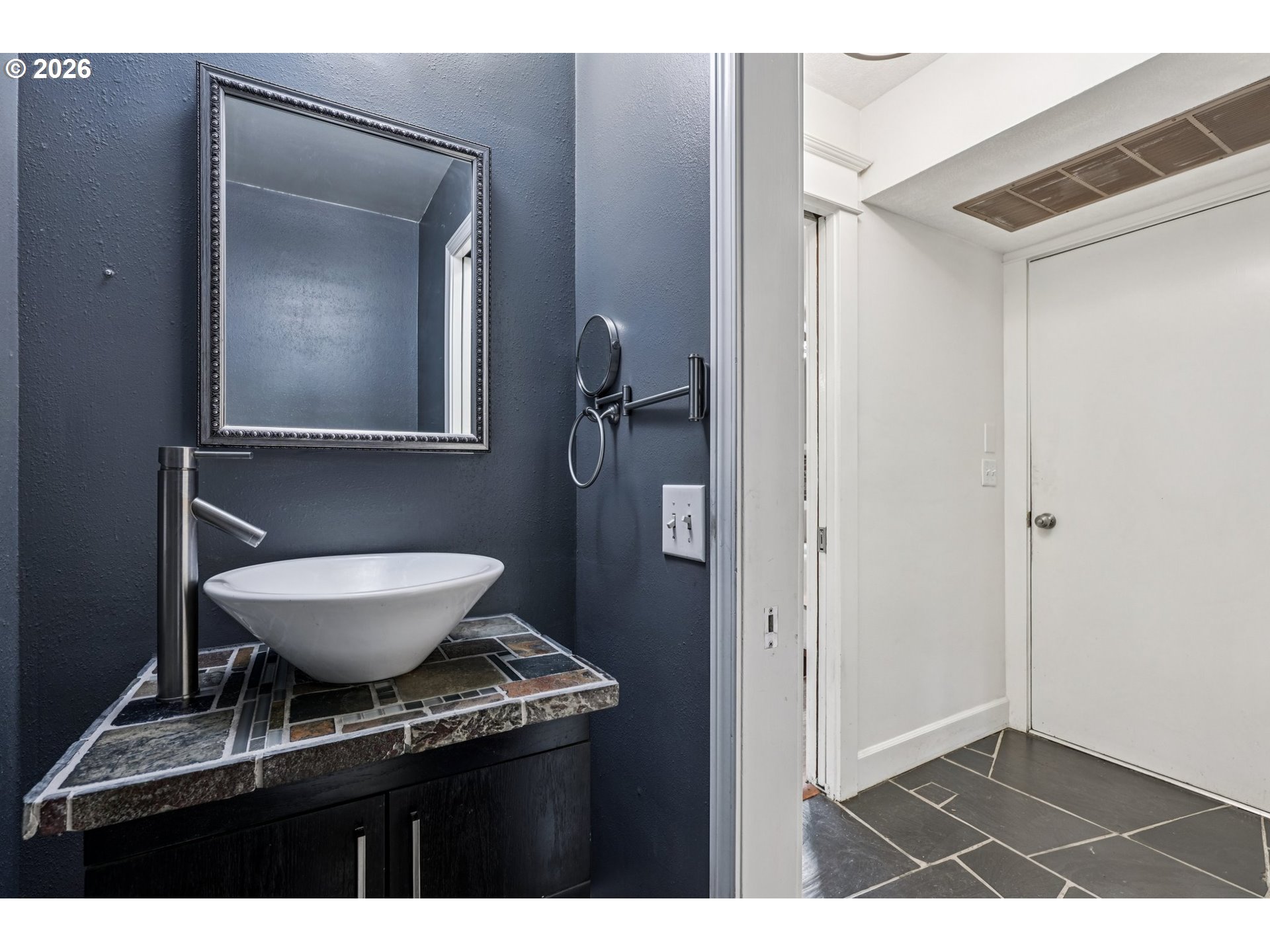 7670 Southwest Danielle Avenue Beaverton, OR 97008 - Photo 29 of 38 a bathroom with a granite countertop sink toilet and mirror