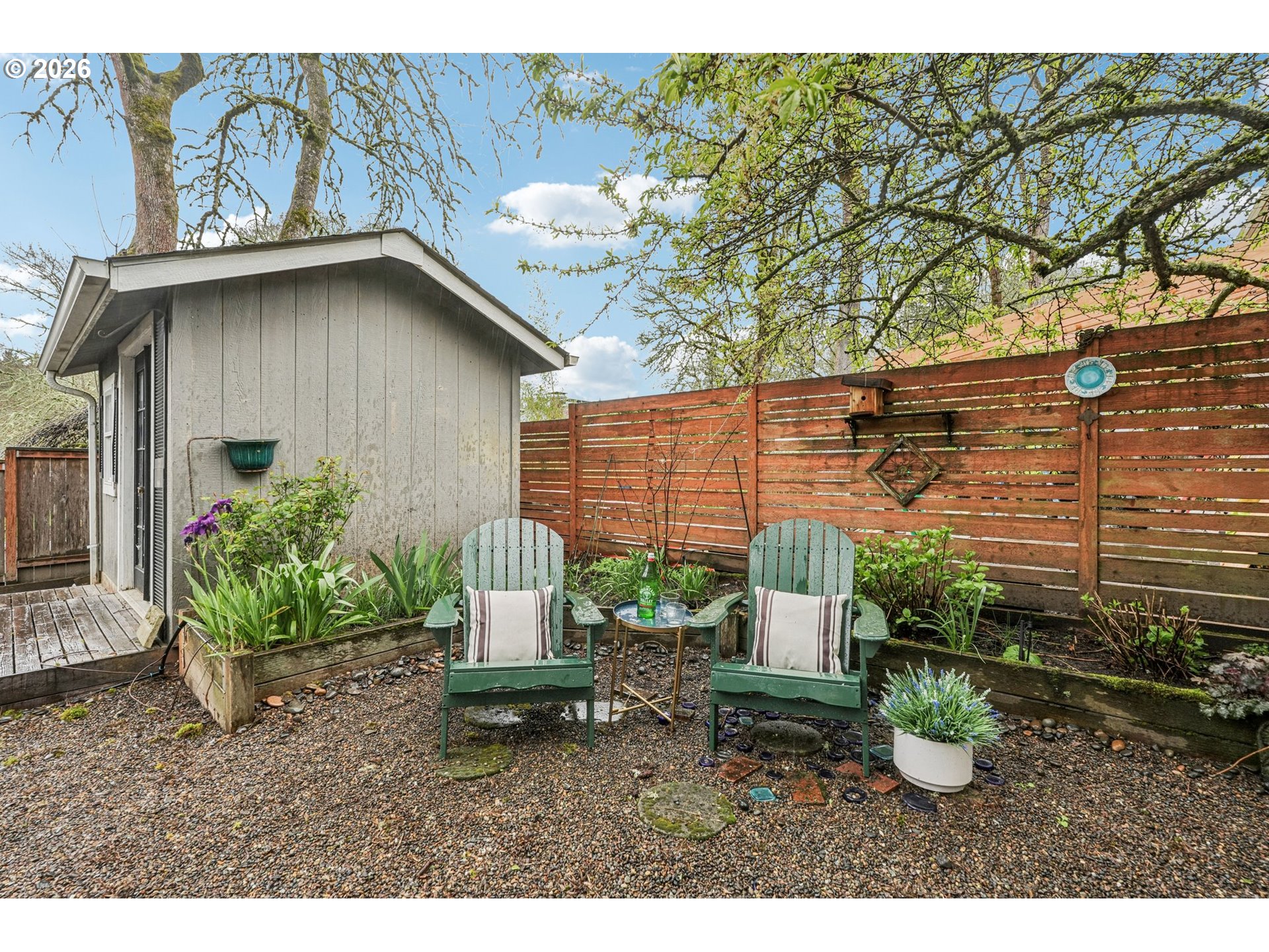 7670 Southwest Danielle Avenue Beaverton, OR 97008 - Photo 33 of 38 a backyard of a house with a garden and plants