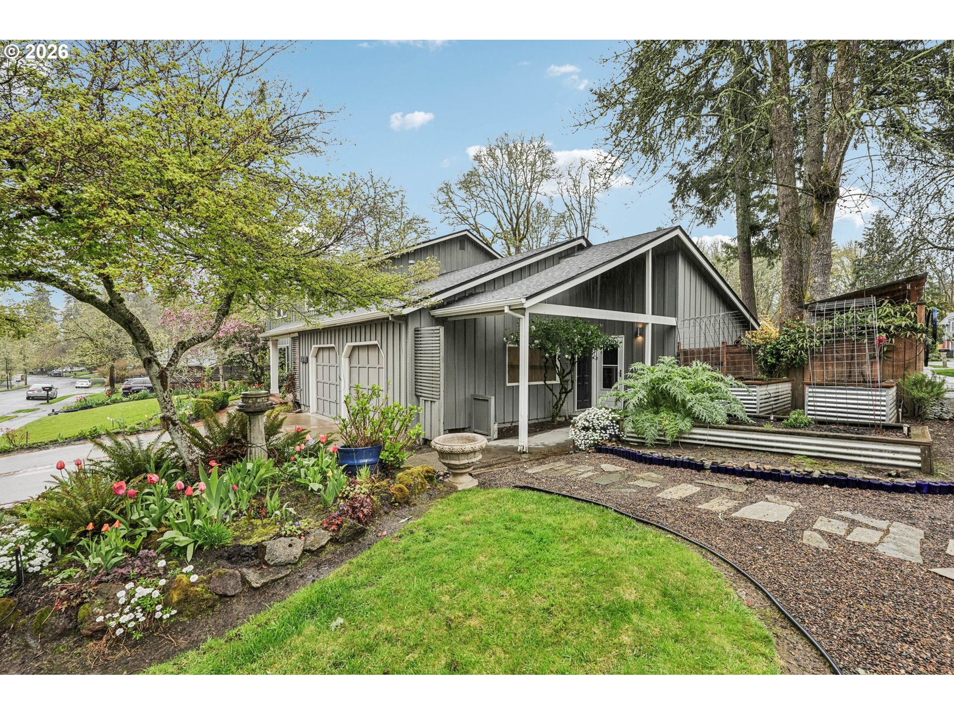 7670 Southwest Danielle Avenue Beaverton, OR 97008 - Photo 37 of 38 a view of a house with garden and yard