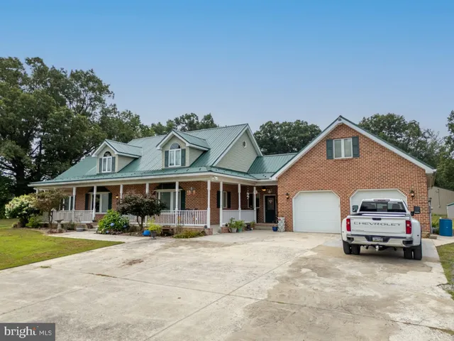 a kitchen with stainless steel appliances a sink and a refrigerator