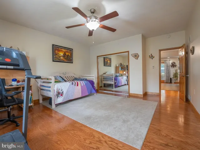 a view of a house with swimming pool and a yard