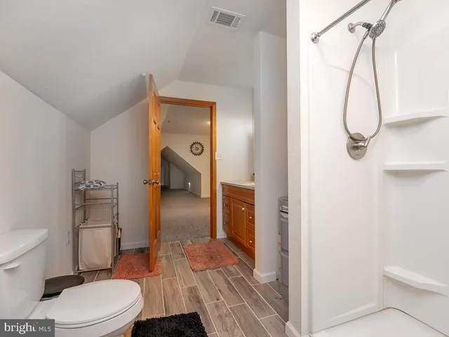 an aerial view of a house with a garden