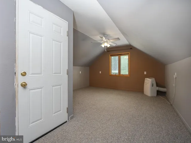 a view of a house with pool and sitting area