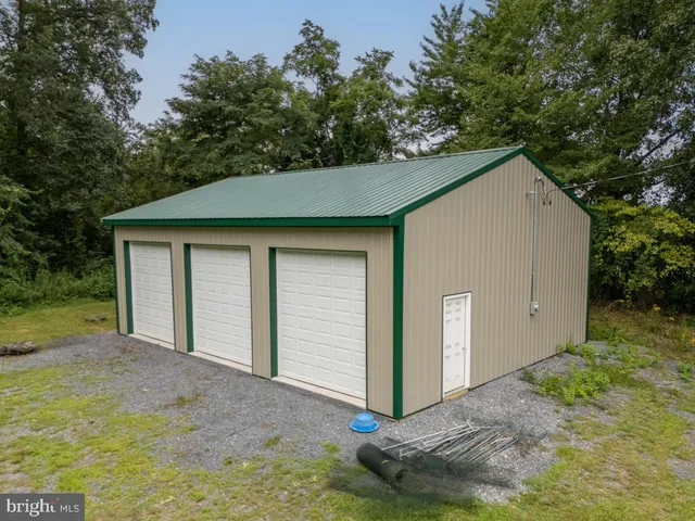 an aerial view of a residential houses with outdoor space