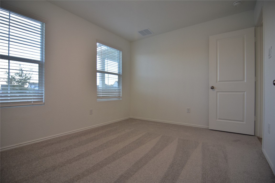 343 Keefer Kyle, TX 78640 - Photo 24 of 38 Empty room featuring carpet and baseboards