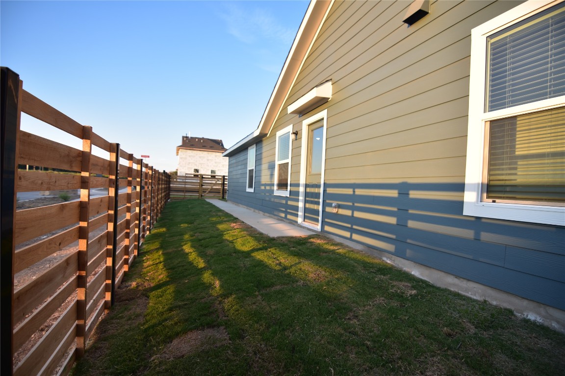 343 Keefer Kyle, TX 78640 - Photo 3 of 38 View of side of property featuring a fenced backyard